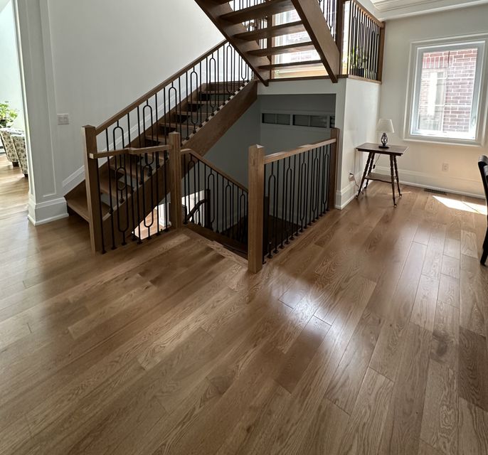 Main floor wood
          installation connecting to stairs