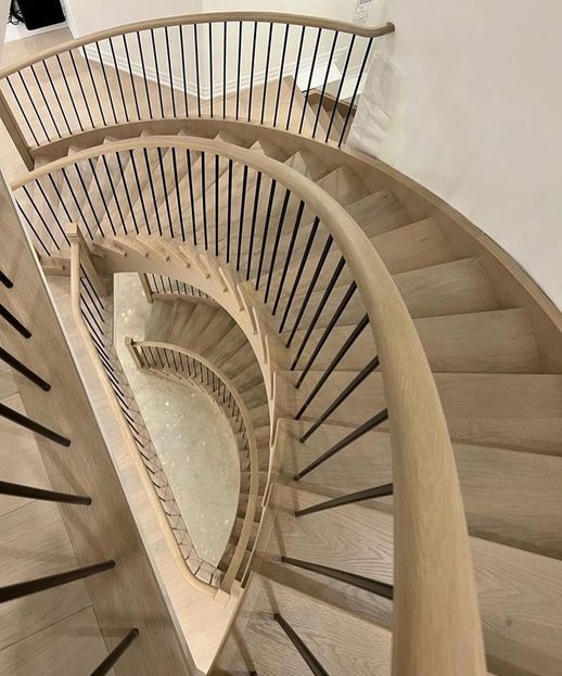 Expertly crafted stairs and
        railings in a Toronto home