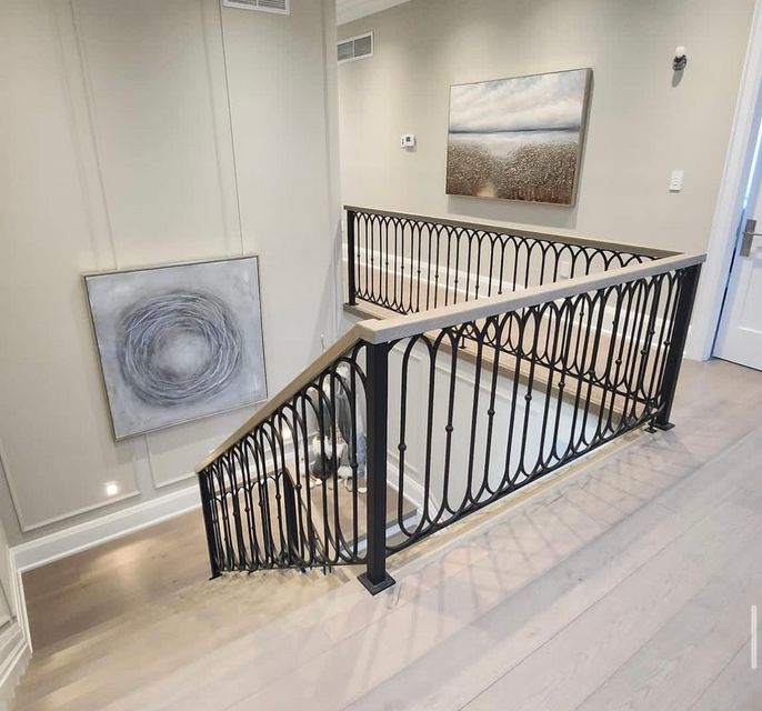 Top floor railings
          and staircase with new flooring installed